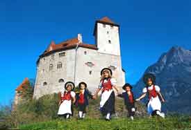 People in the national costume on the slopes of Castle Gutenberg in Balzers